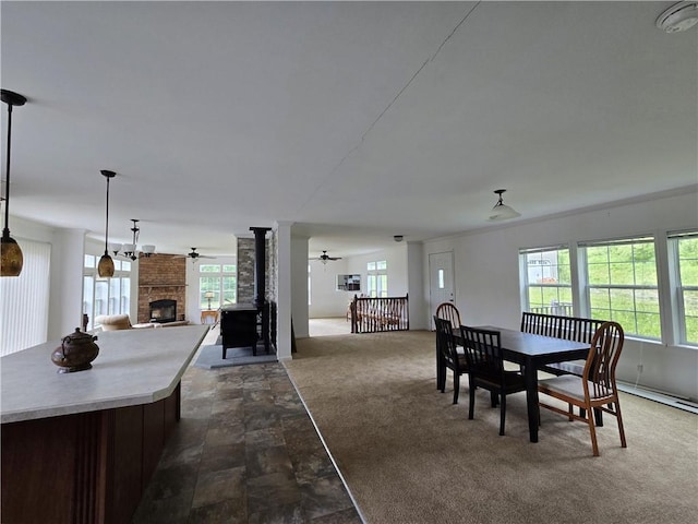 4197 County Highway 26, Colchester, NY 13782 - dining room featuring ceiling fan, dark stone finish floors, a brick fireplace, and dark carpet