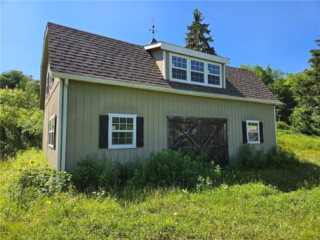 4197 County Highway 26, Colchester, NY 13782 - view of home's exterior featuring roof with shingles and an outdoor structure