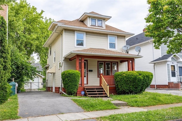 72 Manchester St, Rochester, NY 14621 - american foursquare style home featuring a porch, a garage, an outbuilding, and roof with shingles