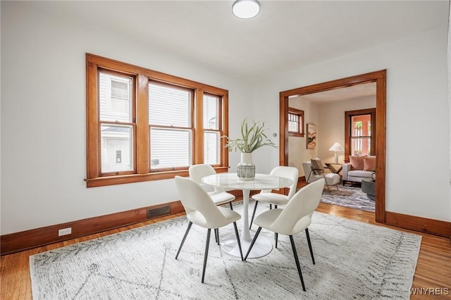 72 Manchester St, Rochester, NY 14621 - dining room with wood finished floors and plenty of natural light