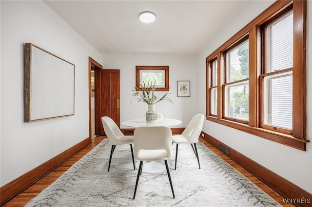 72 Manchester St, Rochester, NY 14621 - dining room with baseboards and wood finished floors
