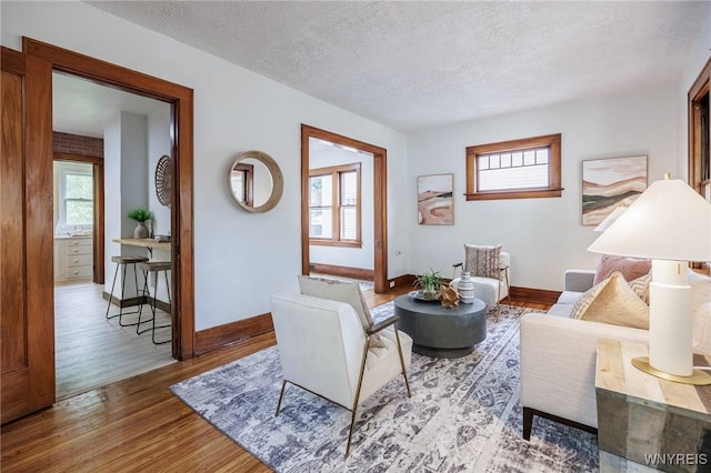 72 Manchester St, Rochester, NY 14621 - living room with wood finished floors and a textured ceiling
