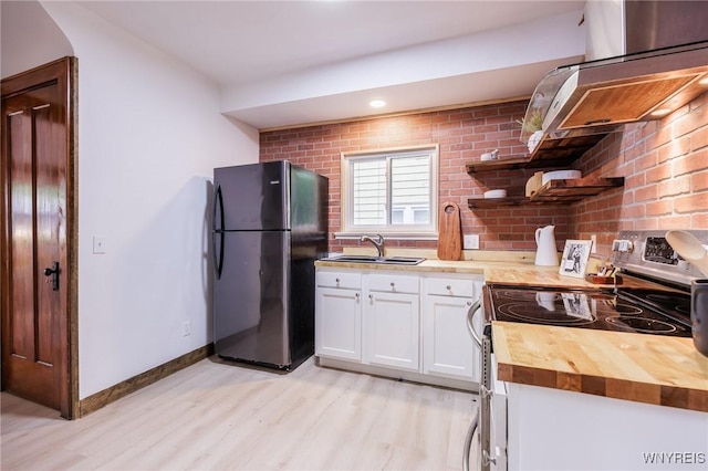 72 Manchester St, Rochester, NY 14621 - kitchen featuring freestanding refrigerator, stainless steel electric stove, open shelves, butcher block counters, and light wood-style floors