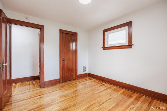 72 Manchester St, Rochester, NY 14621 - unfurnished bedroom featuring light wood-style flooring and a closet