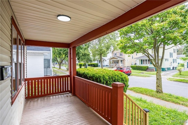 72 Manchester St, Rochester, NY 14621 - wooden porch featuring a residential view