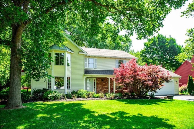 47 Stonington Dr, Pittsford, NY 14534 - traditional home with a front lawn, an attached garage, covered porch, and driveway