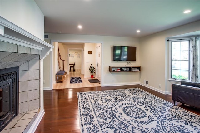 47 Stonington Dr, Pittsford, NY 14534 - living area featuring wood finished floors, recessed lighting, and a tiled fireplace