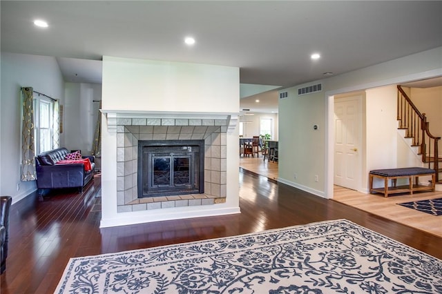 47 Stonington Dr, Pittsford, NY 14534 - living room with wood-type flooring, a fireplace, stairs, and recessed lighting