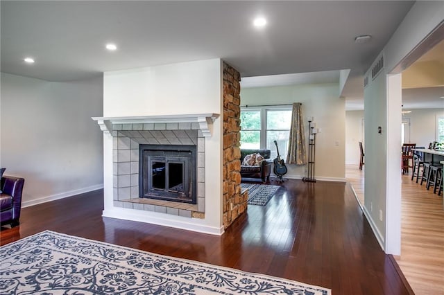 47 Stonington Dr, Pittsford, NY 14534 - living area featuring plenty of natural light, a fireplace, wood finished floors, and recessed lighting