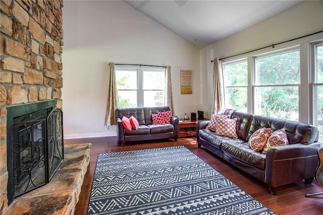 47 Stonington Dr, Pittsford, NY 14534 - living room with wood finished floors, plenty of natural light, a stone fireplace, and high vaulted ceiling