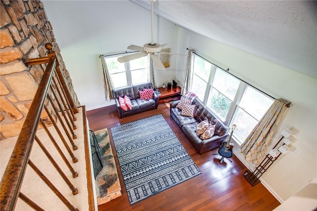 47 Stonington Dr, Pittsford, NY 14534 - living area with a textured ceiling, healthy amount of natural light, a ceiling fan, wood finished floors, and stairs