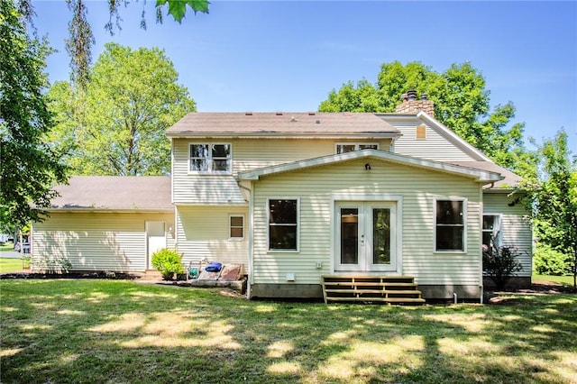 47 Stonington Dr, Pittsford, NY 14534 - rear view of house with french doors, a lawn, a chimney, and entry steps
