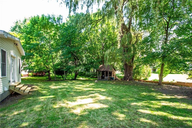 47 Stonington Dr, Pittsford, NY 14534 - view of green lawn featuring entry steps and a shed
