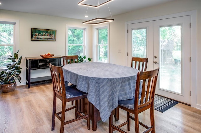 47 Stonington Dr, Pittsford, NY 14534 - dining space with light wood finished floors, healthy amount of natural light, recessed lighting, and french doors