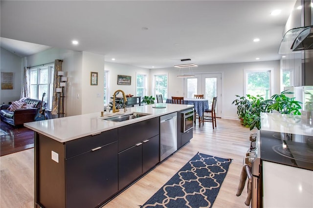 47 Stonington Dr, Pittsford, NY 14534 - kitchen featuring stainless steel appliances, open floor plan, light wood-style floors, light countertops, and healthy amount of natural light