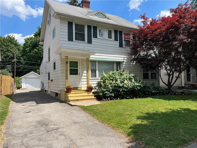78 Falleson Rd, Rochester, NY 14612 - view of front facade featuring a chimney, an outbuilding, a garage, and asphalt driveway