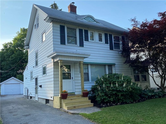 78 Falleson Rd, Rochester, NY 14612 - view of front of property with a chimney, an outdoor structure, asphalt driveway, and a detached garage