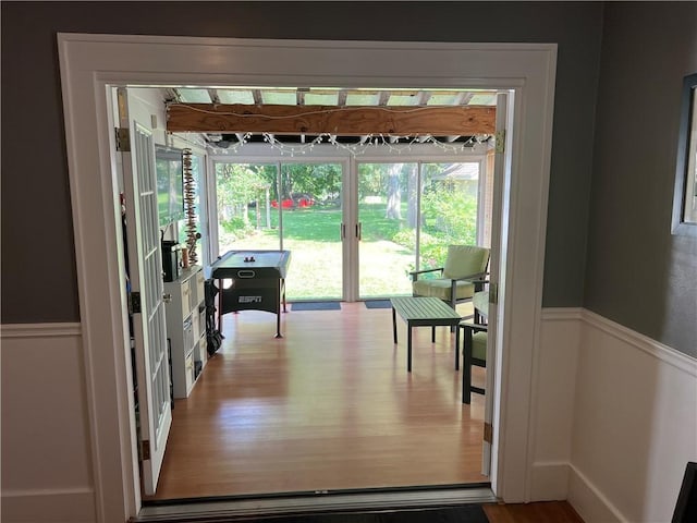 78 Falleson Rd, Rochester, NY 14612 - entryway with a wainscoted wall and wood finished floors
