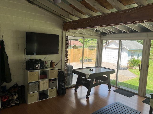 78 Falleson Rd, Rochester, NY 14612 - game room with wood finished floors and concrete block wall