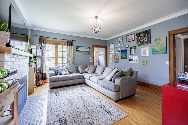142 Holloway Rd, Brighton, NY 14610 - living room featuring light wood-style flooring, crown molding, and a chandelier