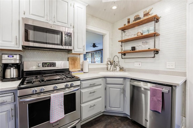 142 Holloway Rd, Brighton, NY 14610 - kitchen with stainless steel appliances, light countertops, gray cabinetry, and white cabinetry