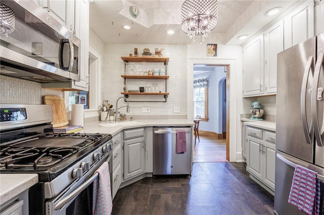 142 Holloway Rd, Brighton, NY 14610 - kitchen with stainless steel appliances, decorative backsplash, light countertops, gray cabinets, and recessed lighting