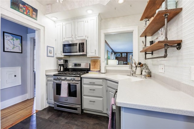 142 Holloway Rd, Brighton, NY 14610 - kitchen with appliances with stainless steel finishes, open shelves, backsplash, and light countertops