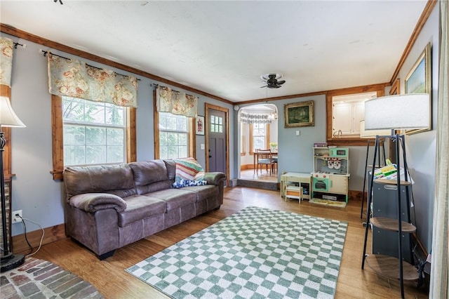 142 Holloway Rd, Brighton, NY 14610 - living area featuring ornamental molding, light wood-type flooring, and a chandelier