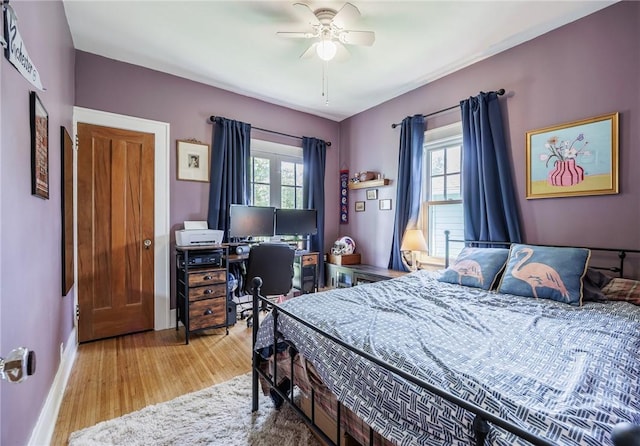 142 Holloway Rd, Brighton, NY 14610 - bedroom featuring wood finished floors, multiple windows, and ceiling fan