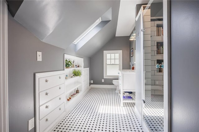 142 Holloway Rd, Brighton, NY 14610 - bathroom featuring lofted ceiling, a skylight, and a shower