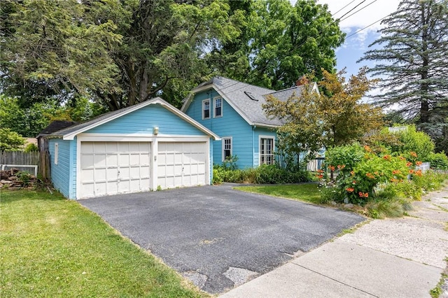 142 Holloway Rd, Brighton, NY 14610 - view of front of property featuring a garage, a shingled roof, and a chimney