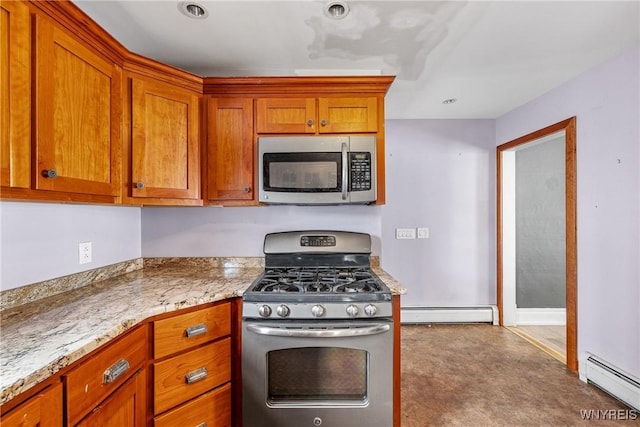 39 Colonial Ave, Lancaster, NY 14086 - kitchen with stainless steel appliances, a baseboard radiator, and brown cabinetry