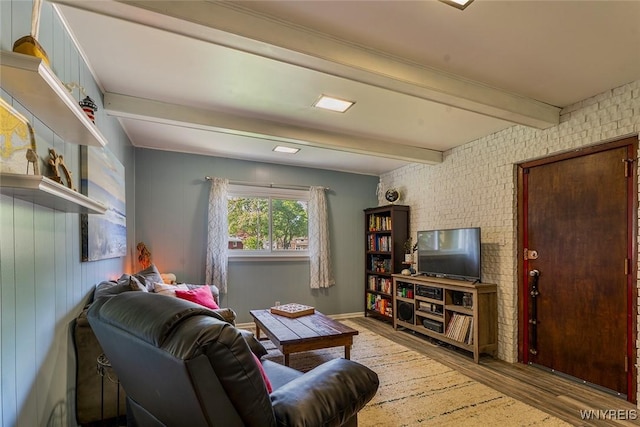 21 Niagara Cir, North Tonawanda, NY 14120 - living area featuring wood finished floors, beamed ceiling, and brick wall