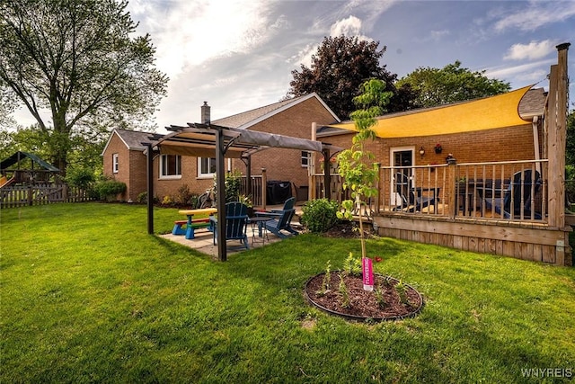 21 Niagara Cir, North Tonawanda, NY 14120 - rear view of house with a pergola, a wooden deck, brick siding, a patio, and a playground