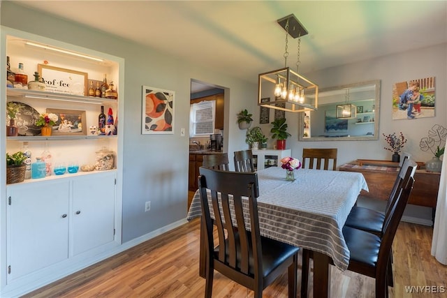 21 Niagara Cir, North Tonawanda, NY 14120 - dining space with wood finished floors and a chandelier