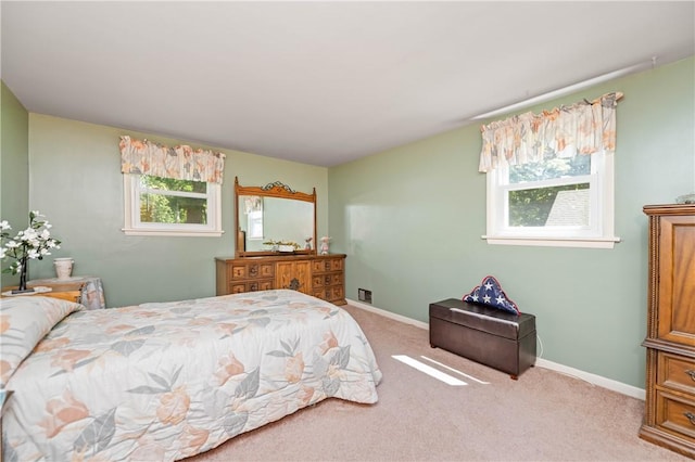 975 Whitlock Rd, Irondequoit, NY 14609 - carpeted bedroom featuring multiple windows