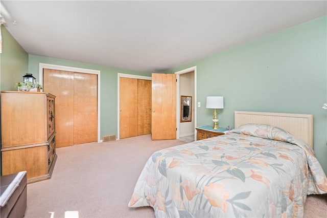 975 Whitlock Rd, Irondequoit, NY 14609 - carpeted bedroom with multiple closets and baseboards