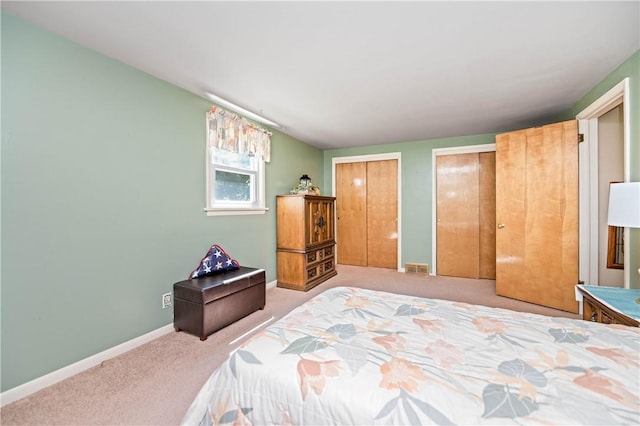 975 Whitlock Rd, Irondequoit, NY 14609 - bedroom with carpet flooring and multiple closets