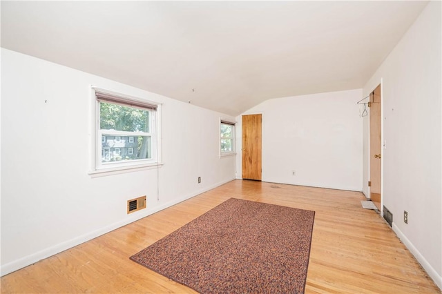 975 Whitlock Rd, Irondequoit, NY 14609 - spare room with lofted ceiling and light wood finished floors