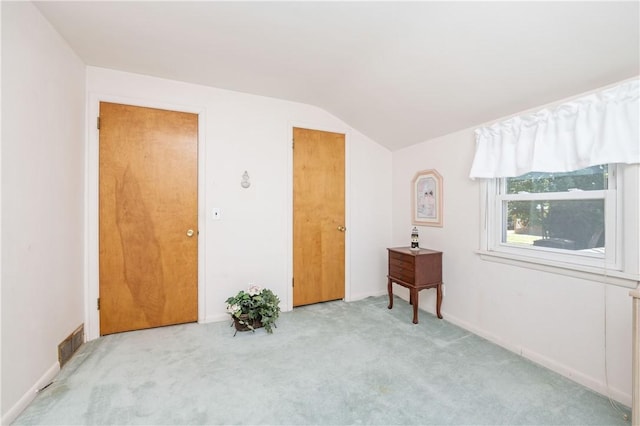 975 Whitlock Rd, Irondequoit, NY 14609 - bedroom with vaulted ceiling and carpet