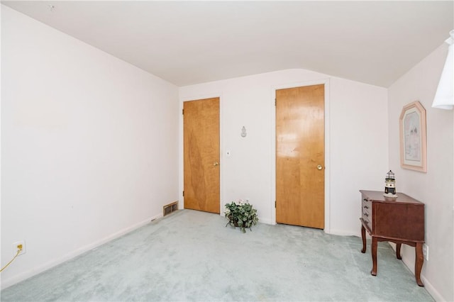 975 Whitlock Rd, Irondequoit, NY 14609 - carpeted bedroom featuring lofted ceiling and baseboards