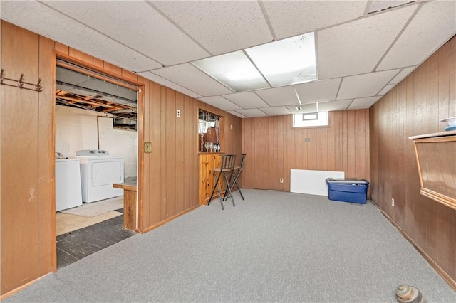 975 Whitlock Rd, Irondequoit, NY 14609 - below grade area featuring independent washer and dryer, wood walls, carpet floors, and a drop ceiling