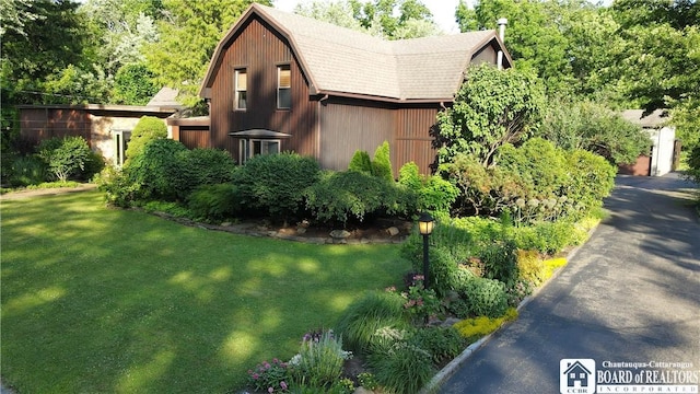 24 W 2nd St, Westfield, NY 14787 - view of home's exterior featuring a gambrel roof and a lawn