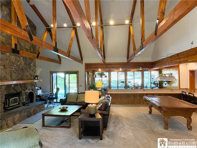 24 W 2nd St, Westfield, NY 14787 - living area with high vaulted ceiling, carpet floors, billiards, beamed ceiling, and a stone fireplace