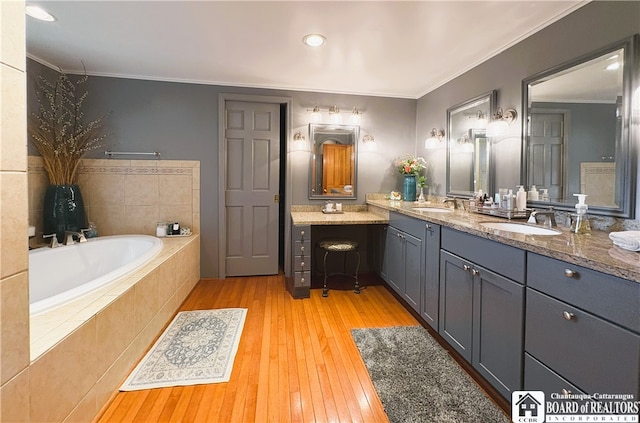 24 W 2nd St, Westfield, NY 14787 - full bath with a bath, double vanity, wood-type flooring, and ornamental molding