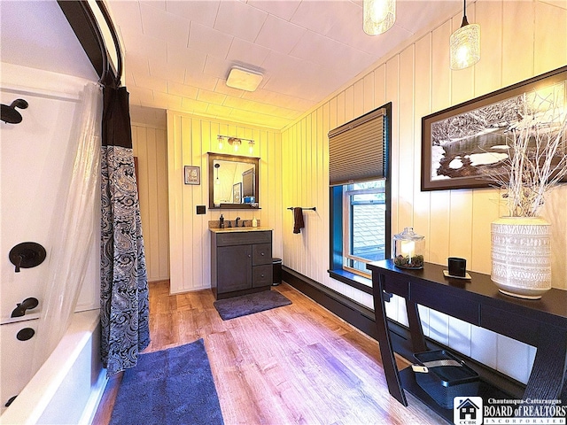 24 W 2nd St, Westfield, NY 14787 - full bathroom with wood finished floors, vanity, and shower / bath combo