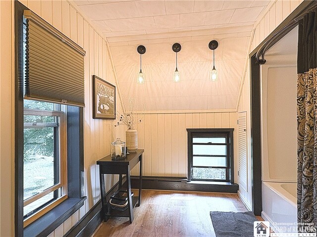 24 W 2nd St, Westfield, NY 14787 - doorway to outside featuring wood finished floors and wood walls