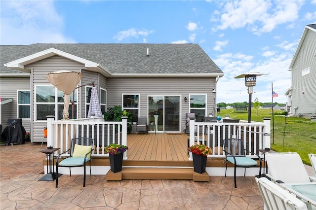 37 Etherington Cres, Chili, NY 14428 - back of house featuring a wooden deck, a shingled roof, a lawn, and a patio