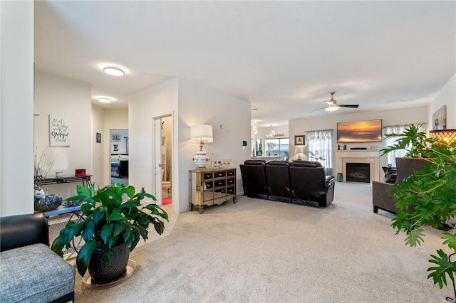 37 Etherington Cres, Chili, NY 14428 - living area featuring light carpet, ceiling fan, and a fireplace