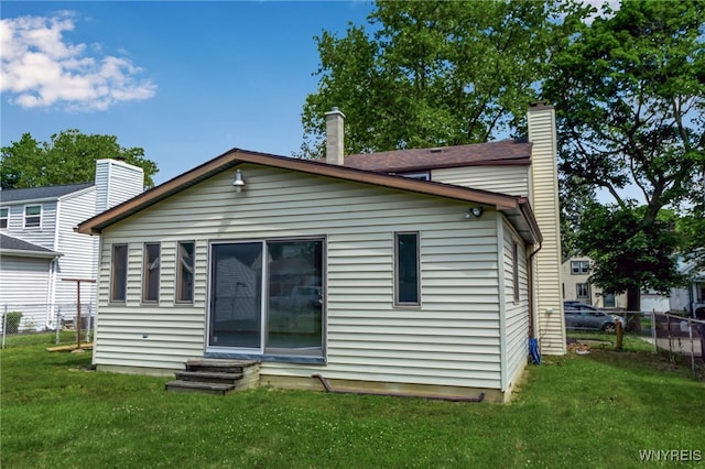 1335 James Ave, Niagara Falls, NY 14305 - back of property featuring entry steps and a chimney